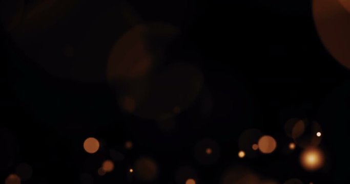christmas gradient gold background with bokeh flowing on black, festive holiday happy new year concept