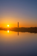 Fototapeta na wymiar Cape May Lighthouse Silhouette Reflection