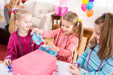 Birthday: Girl Gets Doll Clothes From Friend For Present