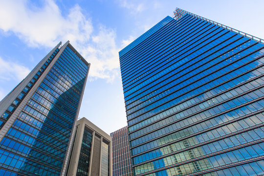 Tokyo office building bottom view with Blue sky