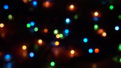 Blurry abstract colorful background. Colored Christmas garland. Bokeh and defocusing of the lens - Powered by Adobe