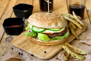 Beef hamburger with whole wheat bun and french fries