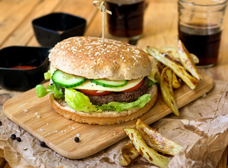 Beef hamburger with whole wheat bun and french fries