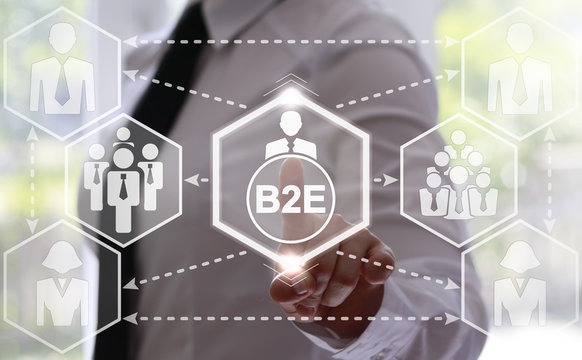 businesswoman presses B2E button on virtual screen. Businessman touched icon business to employee on touch screen. Innovation concept presented by a consultant in business on webinar screen. Hexagon.