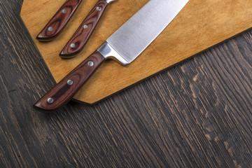 Set of kitchen knifes on woode