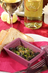 Restaurant dish - escargot in ceramic dish with toast 