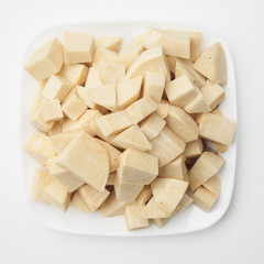 Cubed rutabaga on a plate.