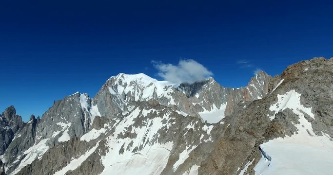 Panoramic view of Western alps whith Mount Blanc and Giant's Tooth (Dent du Geant) from Helbronner roof of europe in Aosta Valley region of Italy