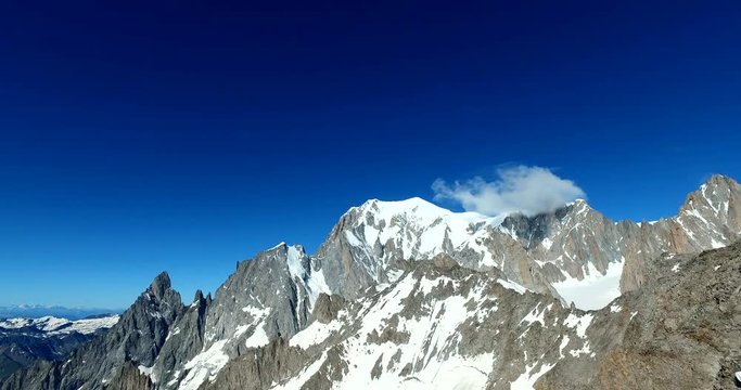 Panoramic view of Western alps whith Mount Blanc and Giant's Tooth (Dent du Geant) from Helbronner roof of europe in Aosta Valley region of Italy