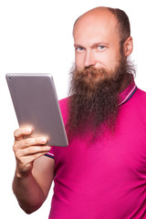 portrait of bald bearded man with tablet and pink t-shirt isolated on white background.
