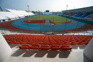 Obraz premium Colorful of stadium seats in background.