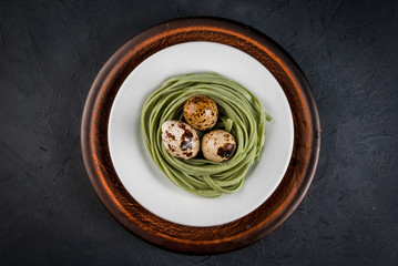 Idea for a light healthy lunch at Easter: pasta, lined in the form of the nest with boiled quail eggs