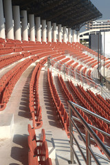 Fototapeta premium Colorful of stadium seats in background.