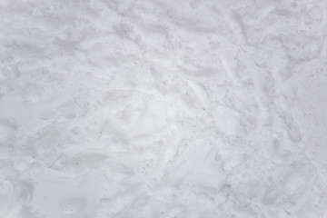 Snow and slush footprints on the road