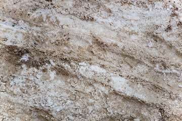 Snow and slush footprints on the road