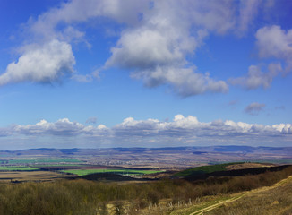 The celestial landscape above the village between the hills