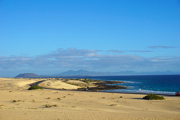 The road through the dunes along the Atlantic Ocean, Canary Islands, Fuerteventura
