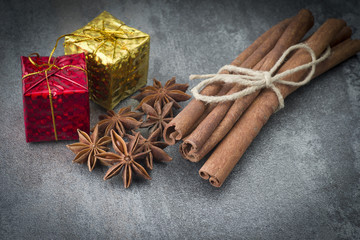 Star anise,cinnamon and licorice on grey background