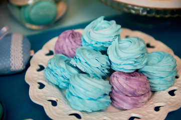 Sweet table for children's birthday party in turquoise and purple. A sense of celebration, of joy. Beautiful sweets