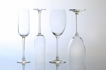 four empty wine glass on a light background