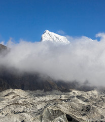 Mountain landscape with Gokyo glacier and snow-capped peaks on background - Nepal, Himalayas