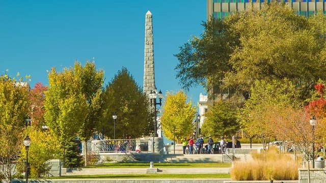 Asheville NC Downtown Scene on a Sunny Autumn Morning with Fall Colored Trees and the Vance Memorial in Front of a Blue Sky