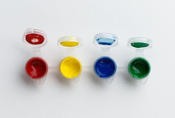 small paint pots on white background
