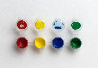small paint pots on white background