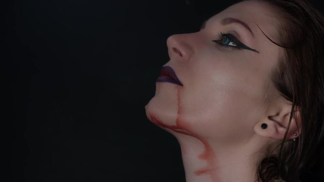 4k shoot of a horror Halloween model - Blood cough from a Vampire mouth