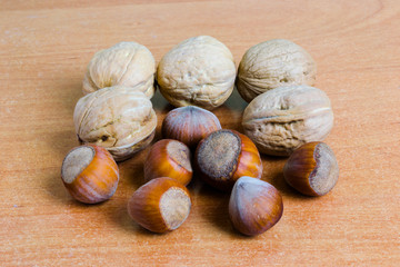 Nuts on the table. Hazelnuts and walnuts.