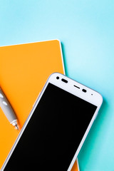 Fototapeta premium Smartphone and stationery