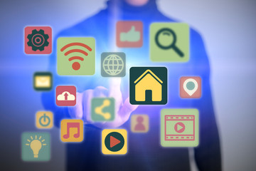 Close up of young man touching icon of media screen. Multimedia