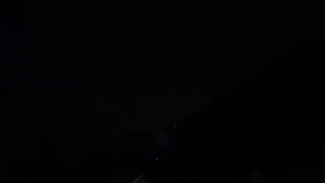 Colorful fireworks flashing in the evening sky - video in slow motion