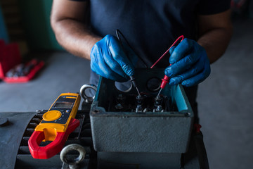 Mechanic fixing a compressor engine