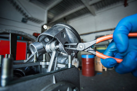 Mechanic fixing a compressor engine