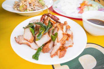 Pork grilled sliced with kaffir lime leaf fried and dried chilli