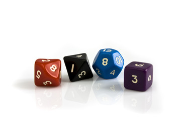 Colored dice isolated on white background. Still life picture taken in studio with softbox.