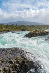 Petrohue Falls and Osorno Volcano with its snowy peak near Puerto Varas, Chile