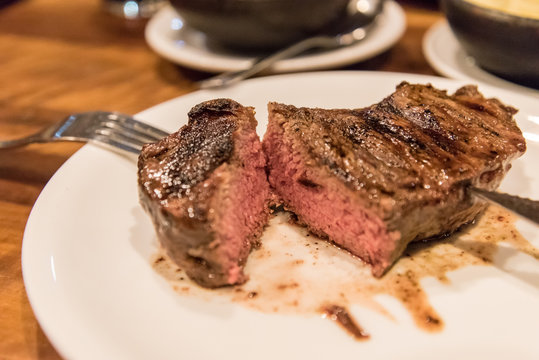 A juicy rib eye steak served in a restaurant
