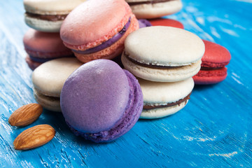 Multicolor macaroon on wood desk. 