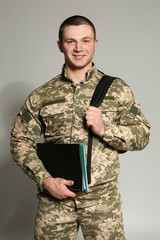 Cadet of military school on grey background