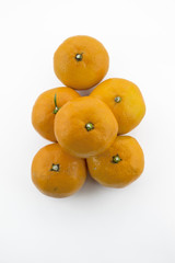 Up view on bunch of tangerines on white background
