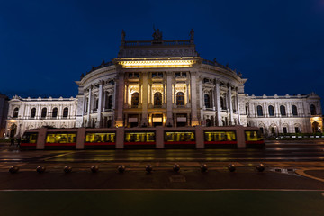 Beautiful view of historic burgtheater imperial court theatre and train in the evening, vienna, austria