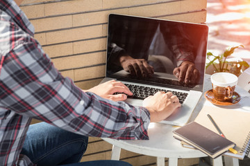 campus boy using laptop