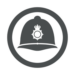 Icono plano casco policia britanico en circulo color gris