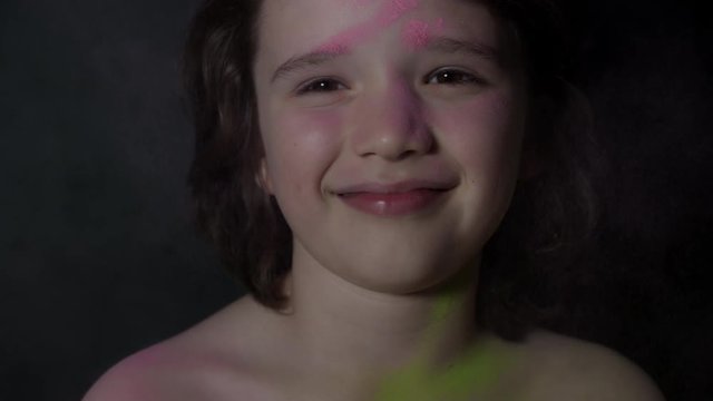 4k shoot of a cute child with Holy Powder thrown on face