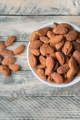 Healthy, tasty and nutritious nuts which help to build strong bones and teeth. Vertical photo