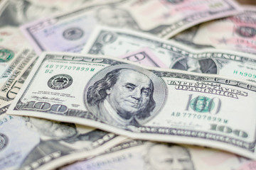 Mixed US dollars, a lot of money background. Finance, business