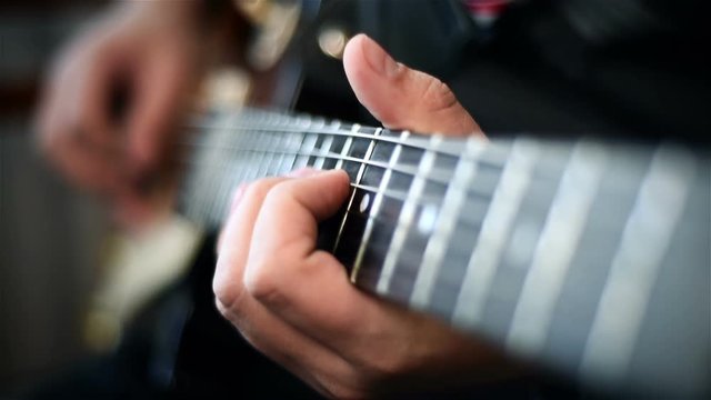 Professional Guitarist Playing Rock Solos An Electric Guitar. Slow Motion Effect