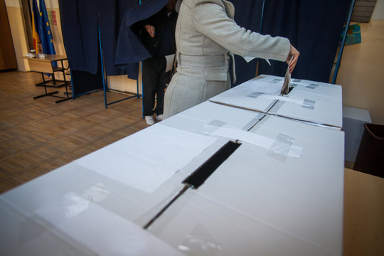 Person voting at polling station